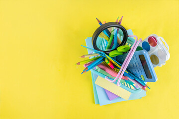 Back to school colorful background containing various school supplies, education accessories for...