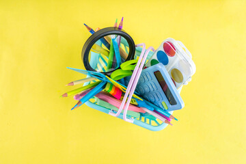 Back to school colorful background containing various school supplies, education accessories for...