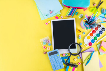 Back to school colorful background containing various school supplies, education accessories for...