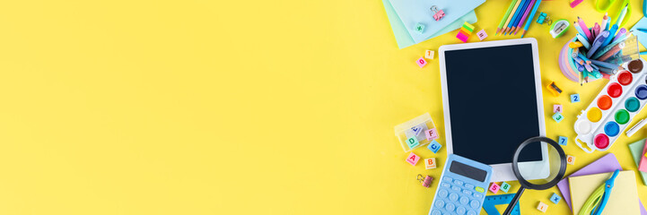 Back to school colorful background containing various school supplies, education accessories for...