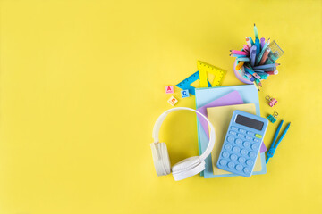 Back to school colorful background containing various school supplies, education accessories for...