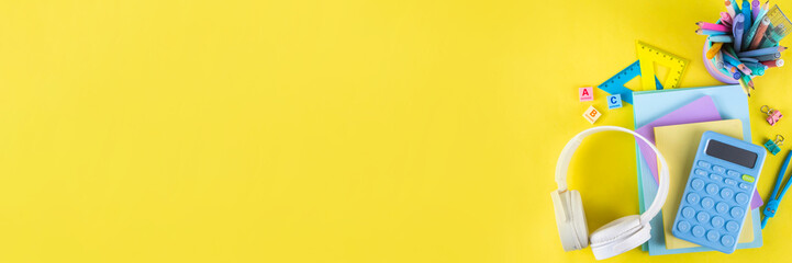 Back to school colorful background containing various school supplies, education accessories for...