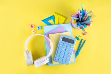 Back to school colorful background containing various school supplies, education accessories for...
