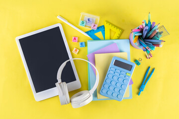 Back to school colorful background containing various school supplies, education accessories for...