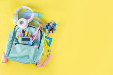 Back to school colorful background containing various school supplies, education accessories for...