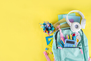Back to school colorful background containing various school supplies, education accessories for...