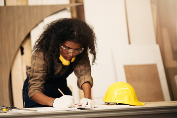 Carpentry Woman Wearing Safety Equipment Crafting Wood in Factory, African American Worker in...