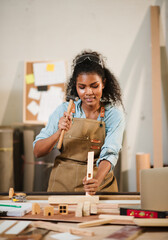 Woodworking Woman Creating Handmade Woodcraft in Small Factory Workshop, Focusing on Design, Detail...