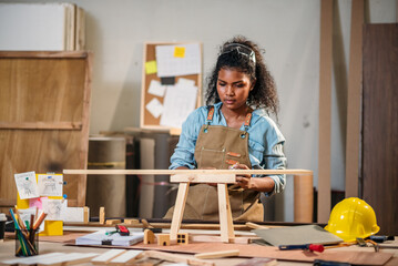 Woodworking Woman Creating Handmade Woodcraft in Small Factory Workshop, Focusing on Design, Detail...