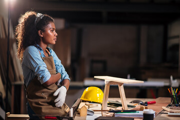 Woodworking Woman Creating Handmade Woodcraft in Small Factory Workshop, Focusing on Design, Detail...