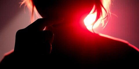 Fototapeta premium Silhouette of figure with finger to lips, shrouded in shadow, discretion, warning