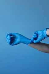 Nurse's hand with blue glove