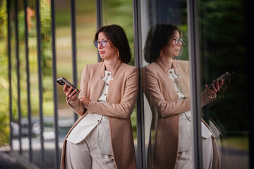 Disappointed Woman Reacting to Phone Message Outdoors