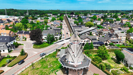 Aerial photo Dutch vintage windmill and turning blades. will take place mill is located in Twello village near Deventer in center of Holland. High quality photo