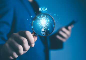 businessman hand holding light bulb concept with innovation and inspiration business idea ideas and...