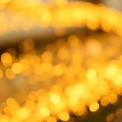 Golden particles blurred decorative background