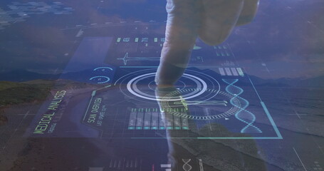 Mid adult man finger pressing medical interface in desert valley, with DNA helix and HUD