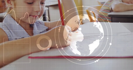 Writing student at school desk with notebook pencil and digital globe graph overlay, copy space