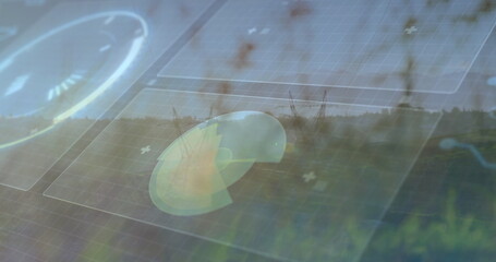 Displaying radar chart graphic overlaying solar panels in grass, with grid overlays and tree line