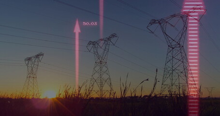 Displaying steel lattice towers monitoring data in rural sunset field, with pink digital overlays