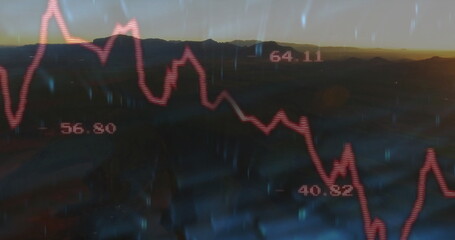 Displaying red line graph tracking numeric labels over mountain ridge at sunset, with rain streaks