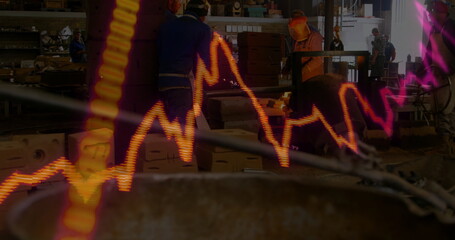 Three male technicians in coveralls and hard hats checking machine in workshop, with data overlay