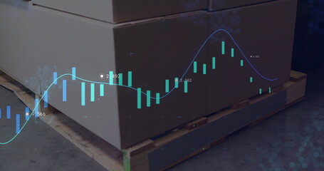 Overlaying blue line graph and green candlesticks on cardboard boxes on wooden pallet in warehouse