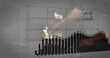 Typing data analyst using laptop keyboard at office desk by window, with floating 3D bar charts