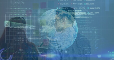 Two professionals studying holographic globe in data lab, with code panels and digital overlays