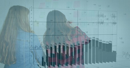 Analyzing projected charts women wearing denim jacket working in office with sticky notes gridlines