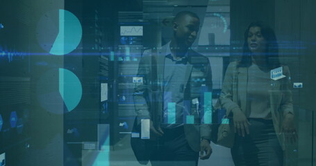 Walking professionals inspecting server racks in data center corridor with holographic charts