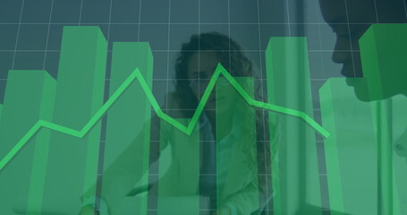 Colleagues in suits analyzing data in meeting room, with green bar chart and line graph