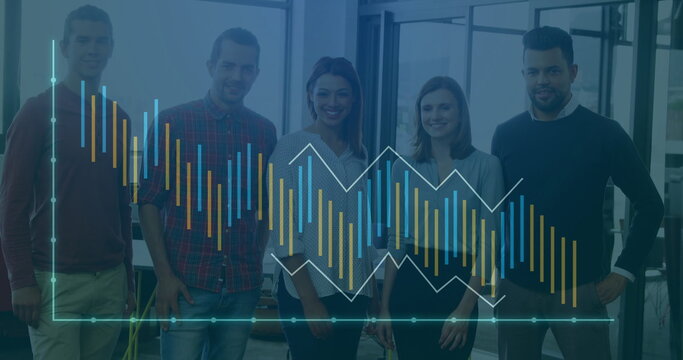 Displaying digital bar and line chart overlay five colleagues standing in modern open-plan office