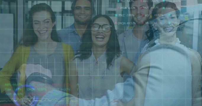 Watching seven colleagues in business attire engaging in presentation at office with charts overlay