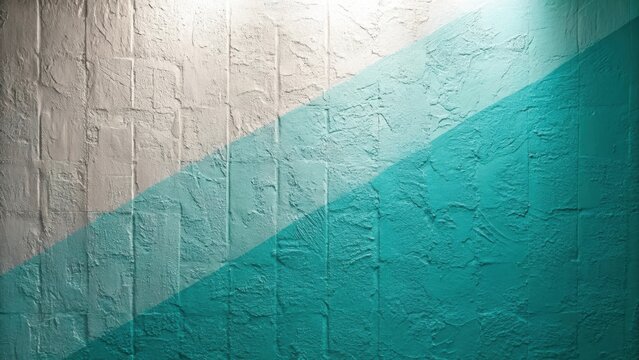 Textured brick wall divided by a diagonal teal and white color block