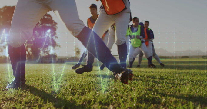 Sliding lower body of female athlete gliding on sunlit grass field, with digital grid overlay - Powered by Adobe