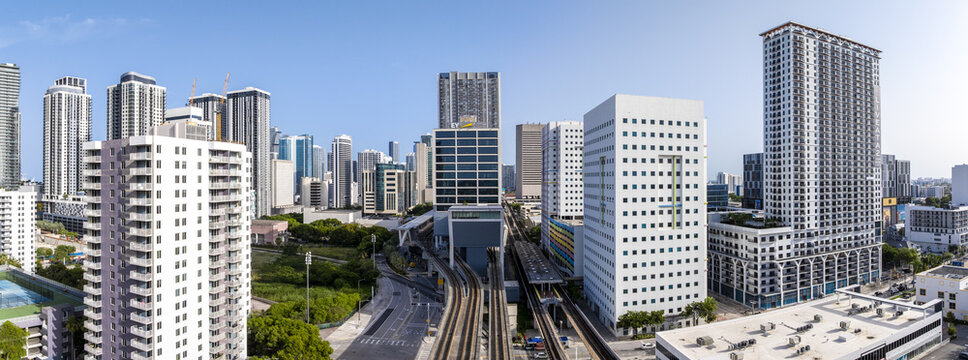 Aerial view of the vibrant city skyline with modern high-rise buildings juxtaposed against lush green spaces, Miami, Florida, United States.