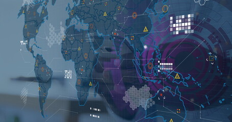 Displaying semi-transparent world map floating over office desk, with hexagonal grids and reticles