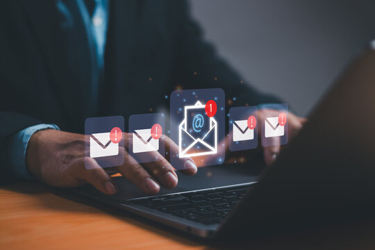 New email notification concept. Email communication for business, digital marketing, businessman working on desk with computer envelope icon on virtual screen