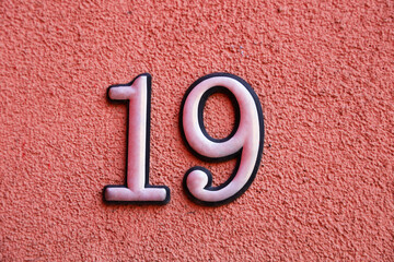 house home Number silver metal digit nineteen 19, nine 9 one 1. old surface and Metal house number...