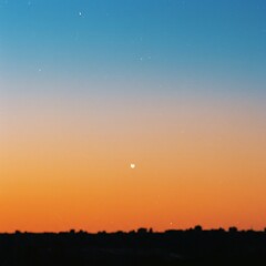 Fototapeta premium Serene Sunset Silhouette: Minimalist Cityscape with a Pale Moon
