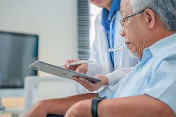 Asian healthcare professionals conduct medical consultations with senior patients using digital...