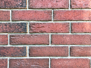 Close-up of a brick wall texture showing red bricks