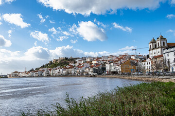 Alcacer do Sal, Portugal view from across the Sado River with Santiago Church on the right and...