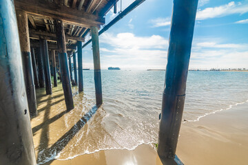 Wooden poles under Stearns Wharf in Santa Barbara