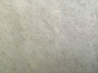 Fototapeta premium Bright plain cream marble texture with subtle veins.