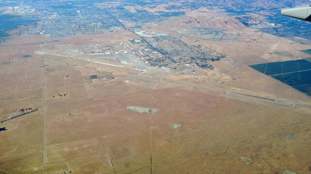 Aerial view of Travis Air Force Base, Napa Valley, and Vacaville, taken from an airplane.