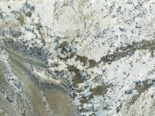 Brown marble texture with prominent orange and black veins.

