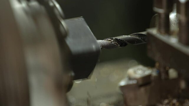 VDO 4K Lathe is working on turning metal parts for industrial use.	

