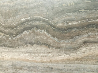 Cream travertine texture with distinctive horizontal vein patterns.

